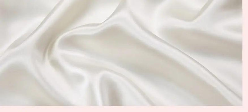 Chroma Chic: White Silk Pillowcase with Colorful Accents